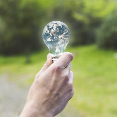 hand-holding-earth-glass-lamp